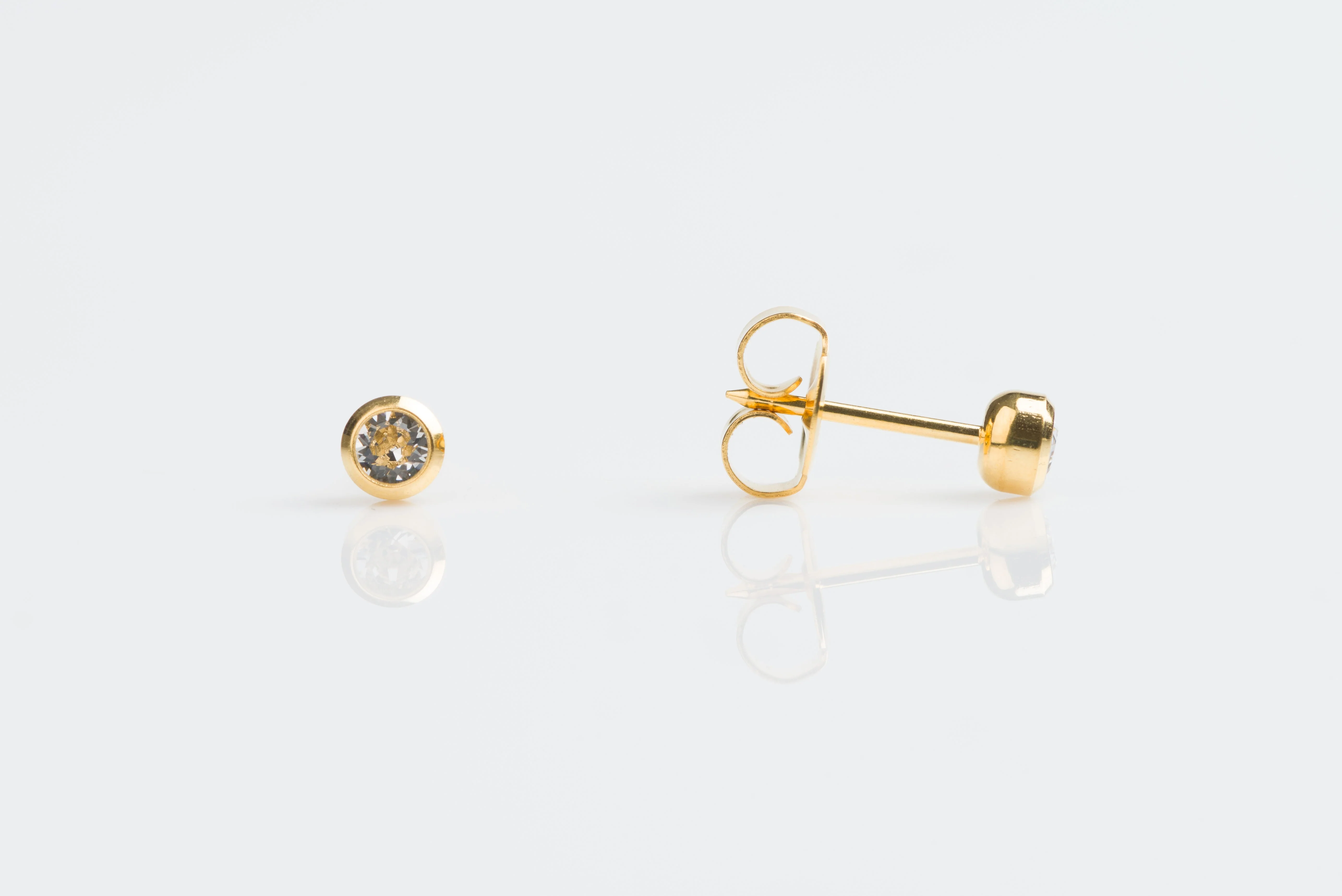 System 75 Bezel Set Piercing Studs - 3mm - April Clear Crystal - Gold Plated
