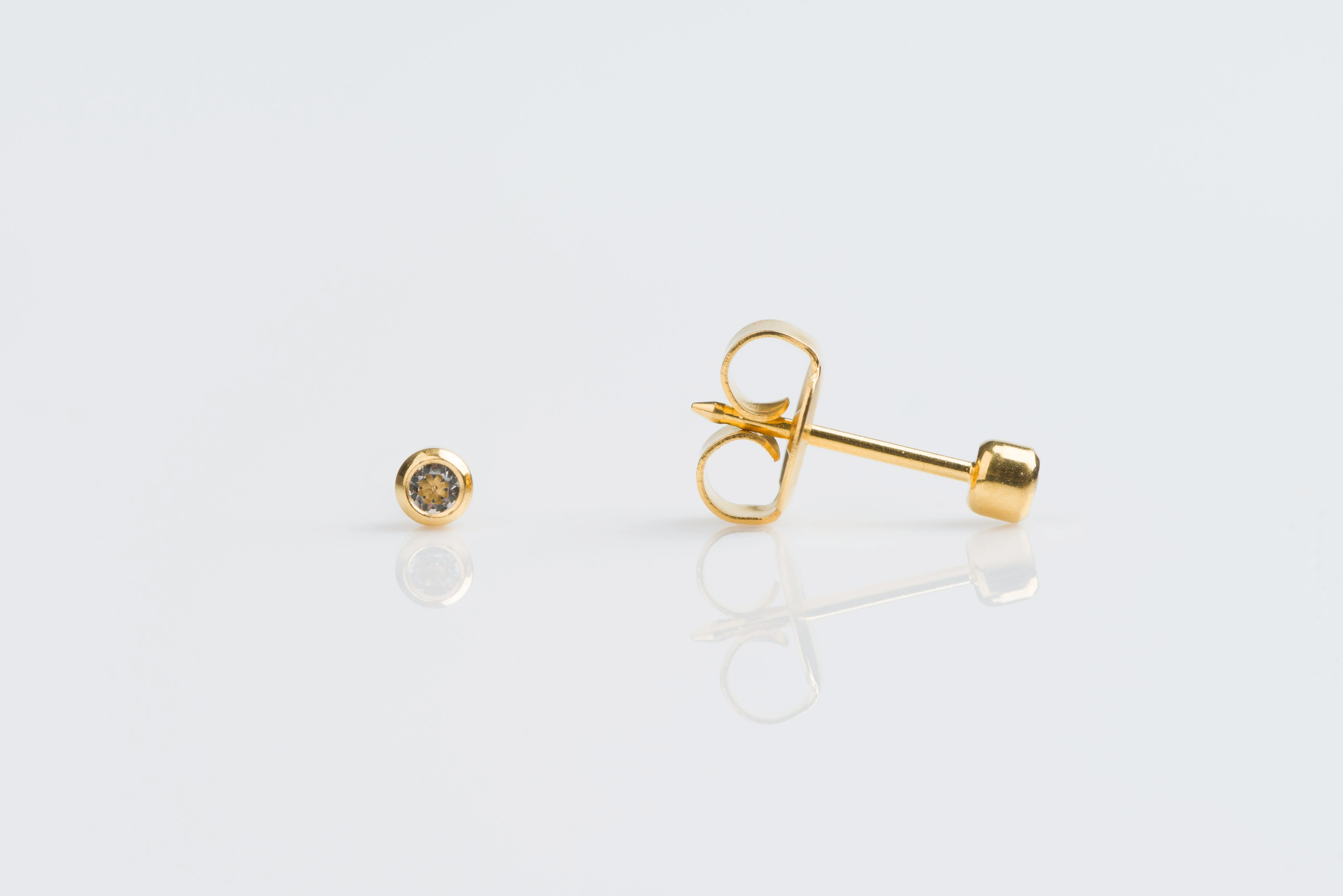 System 75 Bezel Set Piercing Studs - 2mm - April Clear Crystal - Gold Plated