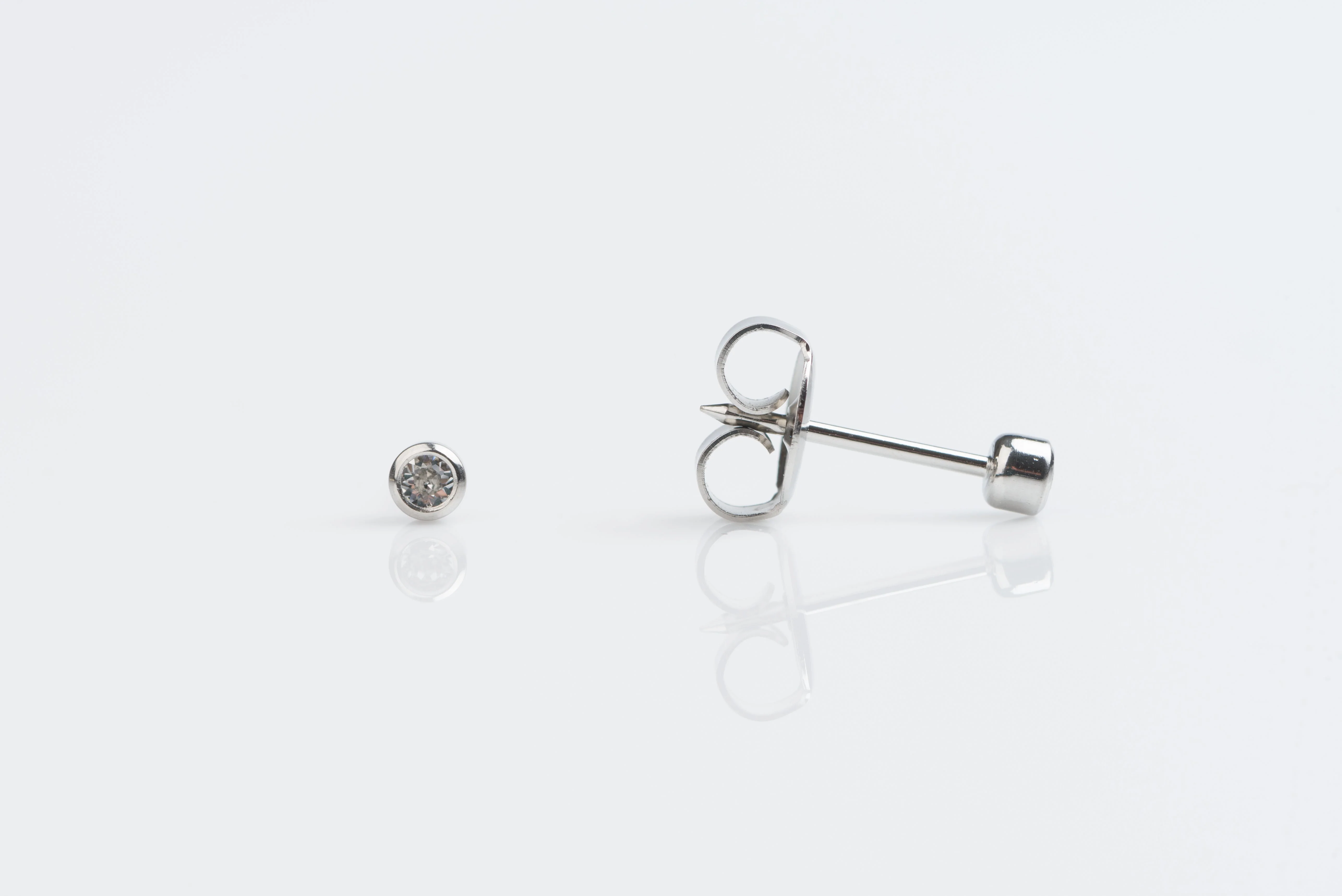 System 75 Bezel Set Piercing Studs - 2mm - April Clear Crystal - Stainless Steel