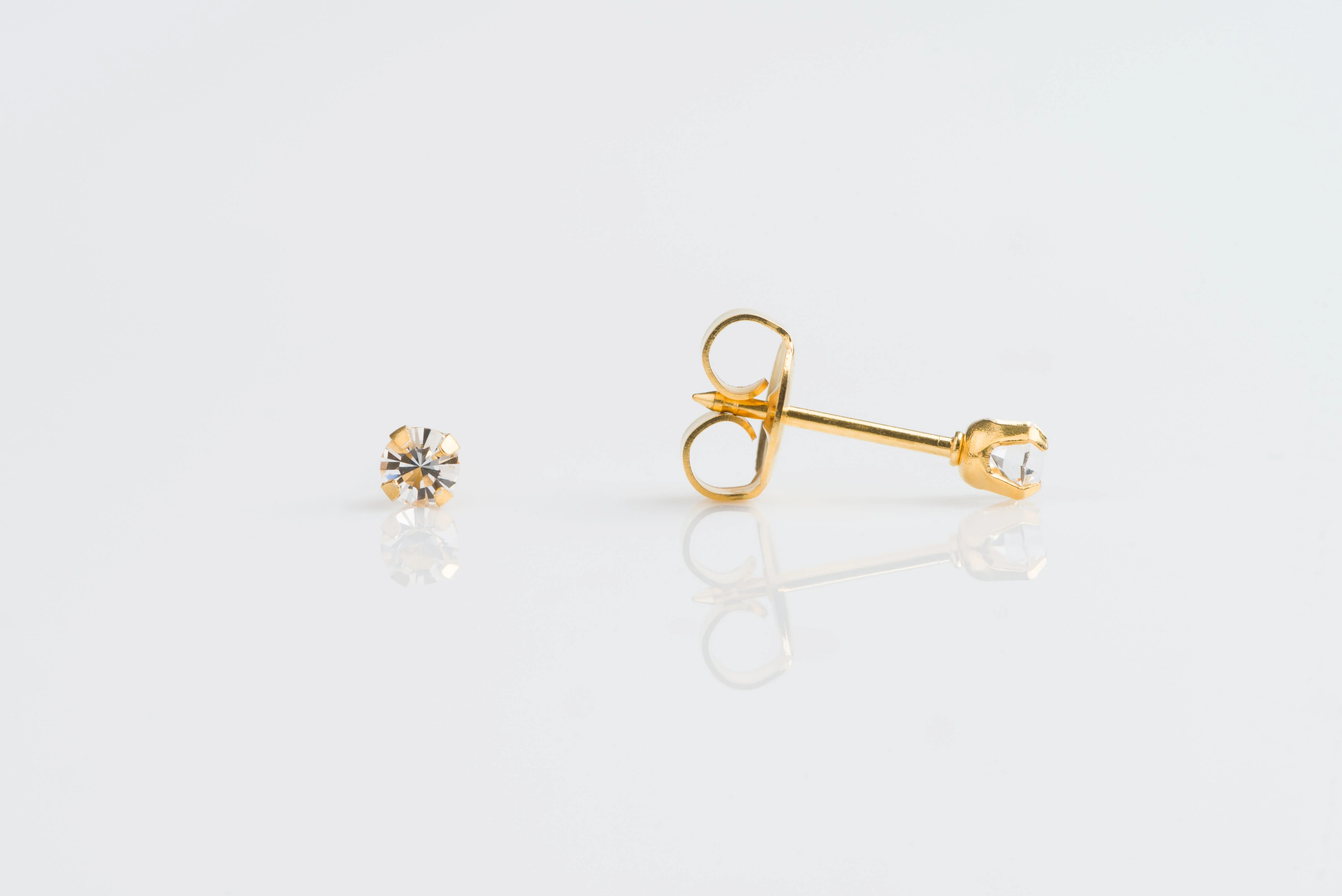 System 75 Prong Set Birthstone Piercing Studs - 3mm - April Clear Crystal - Gold Plated