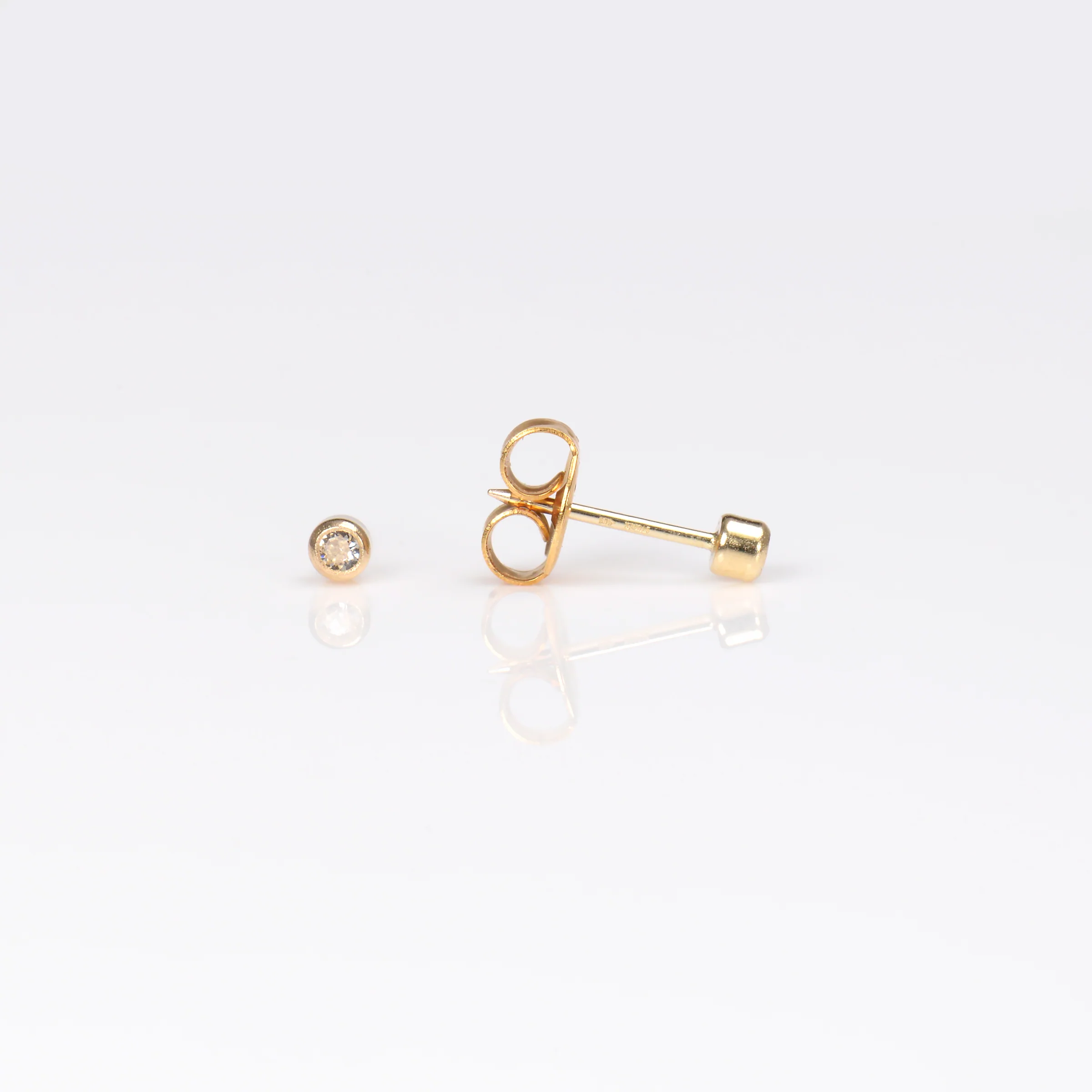 System 75 Bezel Set Piercing Studs - 2mm - April Clear Crystal - 14K Yellow Gold